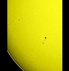 A fine view of the Sun, with some sunspots and faculae, on Apr. 5th, 2015! (Perl 60mm refractor with a solar filter in sheet at the instrument's aperture, and a Perl Echorius 1.3 Webcam; picture stacked with RegiStax, edited and colorized with a image editor; home observatory)