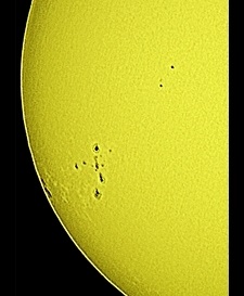 Sun keeping active with a fine view of sunspots and faculae on Apr. 13th, 2015! (Perl 60mm refractor with a solar filter in sheet at the instrument's aperture, and a Perl Echorius 1.3 Webcam; picture stacked with RegiStax, edited and colorized with a image editor; home observatory)