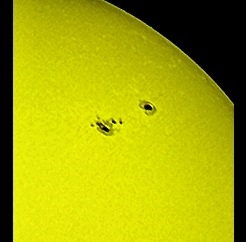 Large sunspots on Jun. 25th, 2015! (Perl 60mm refractor with a solar filter in sheet at the instrument's aperture, and a Perl Echorius 1.3 Webcam; picture stacked with RegiStax, edited and colorized with a image editor; home observatory)