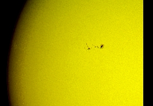 A lesser sunspot seen at Sun on September 29th, 2015 (Perl 60mm refractor with a solar filter in sheet at the instrument's aperture, and a Perl Echorius 1.3 Webcam; picture stacked with RegiStax, edited and colorized with a image editor; home observatory)