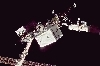 thumbnail to a view of the Space Shuttle Remote Manipulator System (RMS) handing over to the ISS' robotic arm the external stowage platform (ESP-3), on Flight Day 7 / vignette-lien vers une vue du bras tl-manipulateur de la navette spatiale transmettant  celui de l'ISS la nouvelle plate-forme de stockage (ESP-3). Jour de vol n7