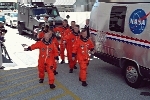 Discovery's crew heads for the Astrovan and the ride to Launch Pad 39B