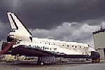 Mission officially over, as the Shuttle arrives to the Orbiter Processing Facility, KSC, having been towed after landing and ground operations