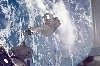 thumbnail to a view of the third spacewalk, on Flight Day 8, with an astronaut anchored to a Canadarm2 mobile foot restraint / vignette-lien vers une vue de la troisime sortie dans l'espace de la mission STS-123 (jour de vol n8); un astronaute est fix au systme de fixation mobile du Canadarm2