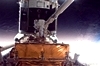 thumbnail to a view of an astronaut is positioned on the end of the remote manipulator system arm during the second spacewalk, on Friday, May 15th (Flight Day 5), dedicated to gyroscopes and batteries / vignette-lien vers une vue d'un astronaute de la seconde sortie dans l'espace, le vendredi 15 mai (jour de vol n5); l'astronaute est au bout du bras manipulateur. La sortie dans l'espace tait consacre aux gyroscopes et aux batteries