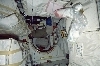 thumbnail to a view of an astronaut working among stowage bags on the middeck of Shuttle Atlantis, on Flight Day 1 / vignette-lien vers une vue d'un astronaute qui s'affaire au milieu de sacs de stockage sur le pont mdian de la navette Atlantis (jour de vol n1)