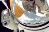thumbnail to a view of the close-up view of the helmet of a STS-127 Space Shuttle mission astronaut / vignette-lien vers une vue rapprochée du viseur d'un astronaute de la mission STS-127
