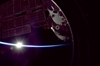 thumbnail to a view of the ISS with the bright Sun on Earth's horizon / vignette-lien vers une vue du Soleil sur l'horizon clairant une partie de l'ISS