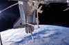 thumbnail to a view of the ISS robotic Canadarm2 grapples the Leonardo Multi-purpose Logistics Module (MPLM) from the payload bay of space shuttle Discovery for relocation to a port on the Harmony node of the International Space (Flight Day 4). Canadian-built Dextre, also known as the Special Purpose Dextrous Manipulator (SPDM), is visible at bottom center / vignette-lien vers une vue du bras robotique Canadarm2 de l'ISS transfre le module cargo Leonardo de la baie de la navtte au port Harmony de l'ISS (jour de vol n4). Le bras Dextre, de fabrication canadienne, se voit en bas au centre