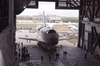 thumbnail to a view of shuttle Discovery carried to the to the transfer aisle in the Vehicle Assembly Building (VAB) in preparation for stacking / vignette-lien vers une vue de la navette Discovery dans le couloir de transfert du Vehicle Assembly Building o elle va tre prpare pour l'assemblage au systme de dcollage