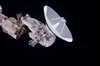 thumbnail to a view of a astronaut during the STS-132 mission first spacewalk, moving a antenna for high-speed Ku-band transmissions. The first spacewalk also aloowed to loosening bolts holding six replacement batteries and adding a spare parts platform to Dextre, a two-armed extension for the station's robotic arm / vignette-lien vers une vue d'un astronaute transportant une antenne Ku-band  haute vitesse de transmission au cours de la 1re sortie dans l'espace de la mission STS-132. La sortie a aussi permis de dvisser les boulons de 6 batteries et d'ajouter une plate-forme  pices dtachs au Dextre, l'extension du bras robotique de l'ISS
