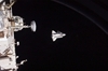 thumbnail to a view of space shuttle Discovery as seen from the International Space Station, when departing from there and performing a fly around / vignette-lien vers une vue de la navette Discovery vue depuis l'ISS alors qu'elle s'est dsarrime et qu'elle reste en vol relatif avec la Station