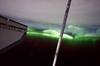 thumbnail to a view of the Southern Lights or Aurora Australis seen from the ISS on July 14, 2011. Part of the orbiter boom sensor system (OBSS) is seen, as it was attached on the end of the shuttle's robotic arm (out of frame). A part of the port side wing of the shuttle is at left / vignette-lien vers une vue d'une aurore australe vue de l'ISS le 14 juillet 2011. On voit une partie du orbiter boom sensor system (OBSS); il a t attach au bout du bras robotique de la navette (hors-cadre). Sur la gauche, on voit l'aile babord de la navette