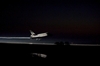 thumbnail to a view of xenon lights guiding space shuttle Atlantis down on the Shuttle Landing Facility's Runway 15 at NASA's Kennedy Space Center in Florida for the final time by 5:57 a.m. (EDT) on July 21, 2011 / vignette-lien vers une vue des lumires au xénon qui guident la navette Atlantis à l'atterrissage sur la piste 15 de la Shuttle Landing Facility du Kennedy Space Center. Ce dernier atterrissage a eu lieu  5h 57 heure d'été de la côte est américaine le 21 juillet 2011