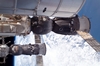 thumbnail to a view of the parked vehicles on the ISS with, here, a Russian Soyuz seen in the foreground and a Russian Progress supply ship in the background. The Permanent Multipurpose Module is at the top of the frame / vignette-lien vers une vue des vhicules spatiaux amarrs  l'ISS avec deux vaisseaux russes, un Soyouz au premier plan et un vaisseau-cargo Progress en arrire-plan. Le Permanent Multipurpose Module est en haut de l'image