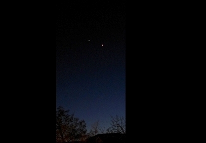 Venus and Jupiter closing  in March 2012 as twilight is transitioning into night (Nikon S3100 compact digital camera; home observatory)