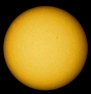 The Sun as of Feb. 16, 2013 (Nikon S3100 compact digital camera with 8x21 binoculars equipped with a solar filter in sheet ahead one objective of the binoculars (and the other one occulted); the picture was colorized into yellow; home observatory)