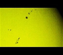 Sunspots as of Apr. 14, 2014 as such a activity, part of a larger area still, is remarkable in the otherwise feeble solar cycle n 24 (Perl 60mm refractor with a solar filter in sheet at the instrument's aperture, and a Perl Altaos 0.35 Webcam; picture stacked with RegiStax and colorized yellow; home observatory)