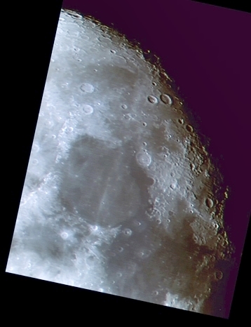 Waning gibbous Moon three days after full with a fine northeastern limb from Hercules and Atlas craters (up) down to the ridge of Mare Crisium (down) (Perl 60mm refractor and a Perl Altaos 0.35 Webcam; picture stacked with RegiStax, colorized into medium Agfa and processed into a image editor; home observatory)