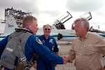 A member of the STS-121 crew is arriving in KSC being greeted by Center Director Jim Kennedy