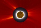the July 11th, 2010 total solar eclipse as seen like a composite  mixing a solar eclipse photo with a SOHO image of the Suns outer corona as the Moon dark silhouette was covered with a SDO image of the Sun in the extreme ultraviolet light