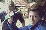 Flight Day 1. Commander Eileen Collins and Mission Specialist Steve Robinson in the Shuttle flight deck hours after launch