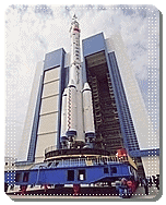 the Long March-II F launcher with the Shenzhou-7 vessel being transported to the launch pad