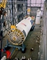 vignette-lien vers une vue du premier tage de la fuse Saturn V prpare pour son assemblage final dans le grand hangar du Vehicle Assembly Building du Kennedy Space Center
